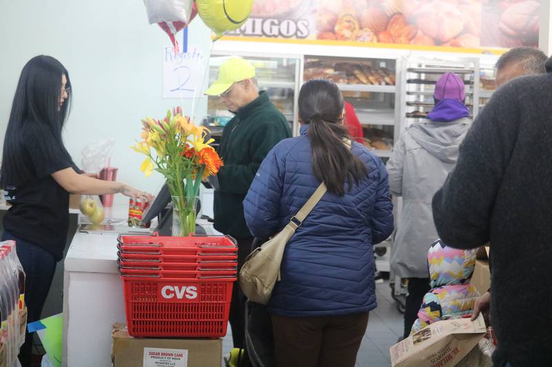 Customers take to DeKalb Fresh Market on its opening day. The store, located at 304 N. Sixth Street in DeKalb, celebrated its grand opening on Tuesday, Nov. 21, 2023.