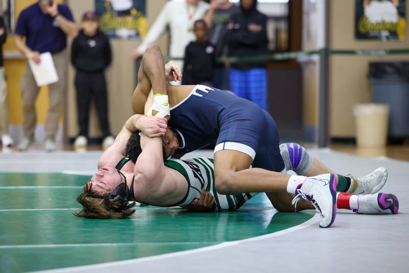 Bishop McNamara's Alex Kostecka, bottom, wrestles Chicago Hope Academy's Chance Woods in the 138-pound championship match during the IHSA Class 1A Coal City Sectional on Saturday, Feb. 14, 2026.