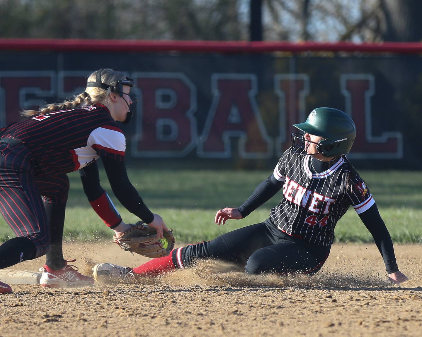 Benet's Angela Horejs (44) slides into second base during softball game between Benet at Yorkville.  April 5th, 2024.