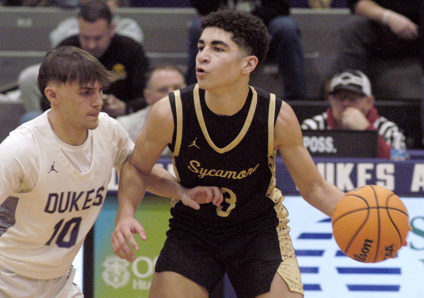 Sycamore's Marcus Johnson brings the ball up court against Dixon's Brady Feit. The Dixon Dukes hosted  the Sycamore Spartans in a non-conference game  on Friday, December 19th, 2025.