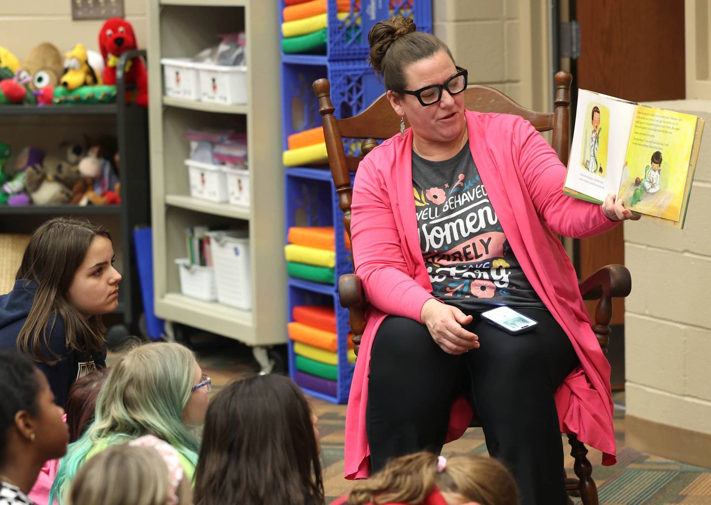 Cortland Elementary School librarian/media assistant Leslie Leahy reads a book to fourth graders Tuesday, March 31, 2026 in the library at the school.