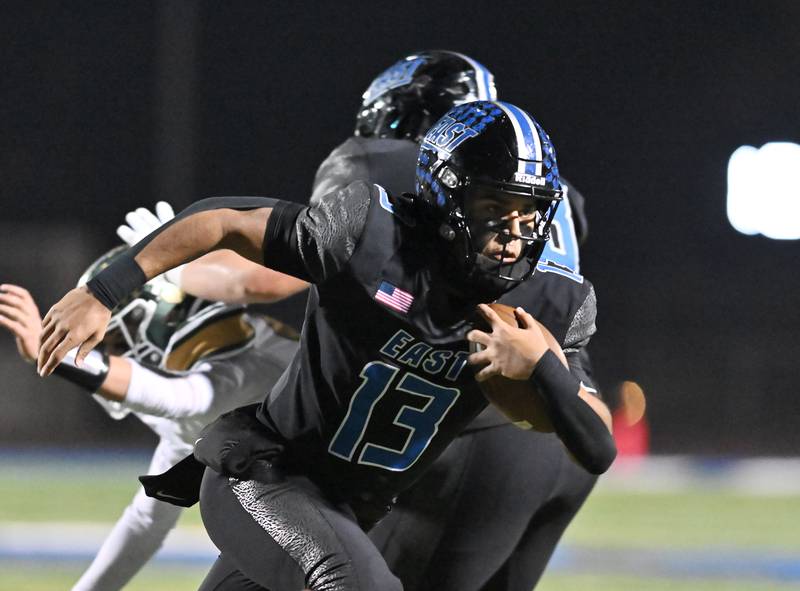 Lincoln-Way East's quarterback Jonas Williams (13) scrambles for a first down during the IHSA Class 8A Quarterfinals game against Stevenson on Friday, Nov. 15, 2024, at Frankfort. (Dean Reid for Shaw Local News)