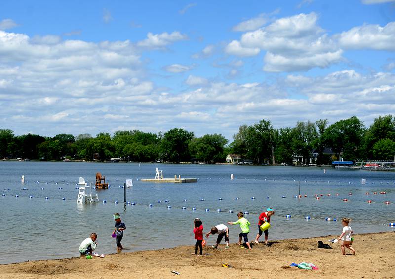 Children from a birthday party play on the beach Monday, May 23, 2022, at Crystal Lake's Main Beach, 300 Lakeshore Drive, in Crystal Lake.