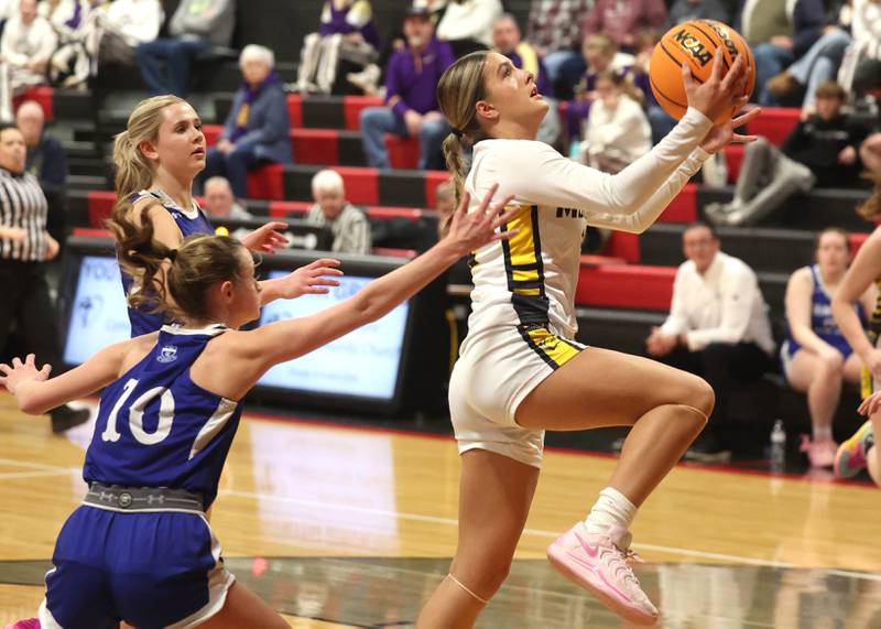 Yorkville Christian’s Danielle Bulson gets a layup in front of Hinckley-Big Rock's Grace Michaels during their Class 1A regional game Tuesday, Feb. 17, 2025, at Indian Creek High School in Shabbona.