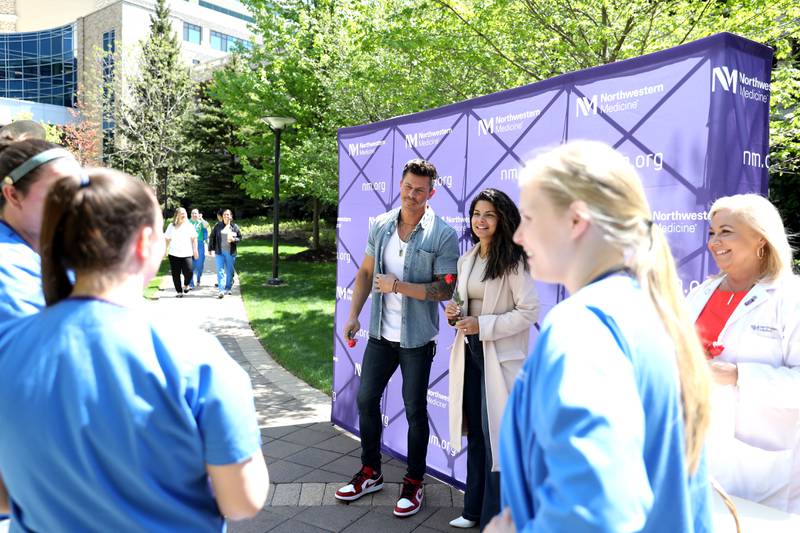 Bachelor in Paradise stars Kenny Braasch and Mari Pepin greet nurses outside Northwestern Medicine Central DuPage Hospital in Winfield as part of National Nurses’ Week festivities on Wednesday, May 10, 2023.