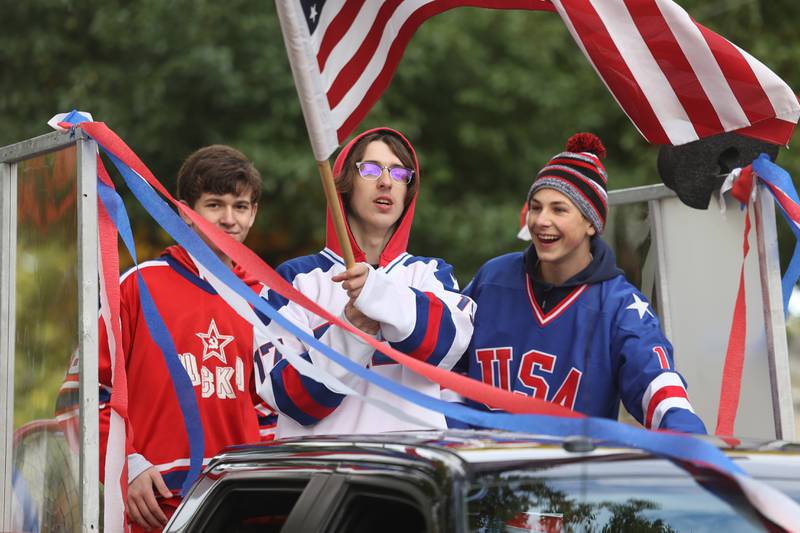 Members of the Plainfield High School Hockey Team ride in the 70th Annual Plainfield Homecoming Parade. Saturday, Oct. 8, 2022, in Plainfield.