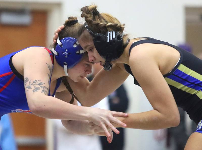 McKenzie Lessner of Dundee-Crown, left, battles Wheeling’s Nikol Orendarchuk at 155 pounds in IHSA Regional wrestling semifinal action on Saturday, Feb. 1, 2025, at  Hampshire High School  in Hampshire.