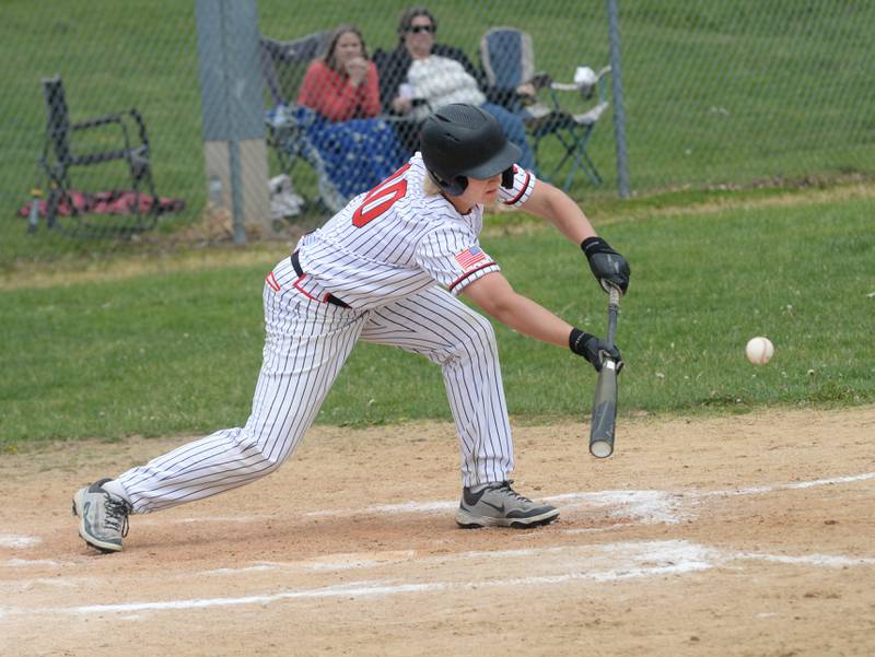 Forreston's Kye Alderks lays dow a sacrifice bunt against Fulton at the 1A Amboy Regional on Saturday, May 24, 2025.