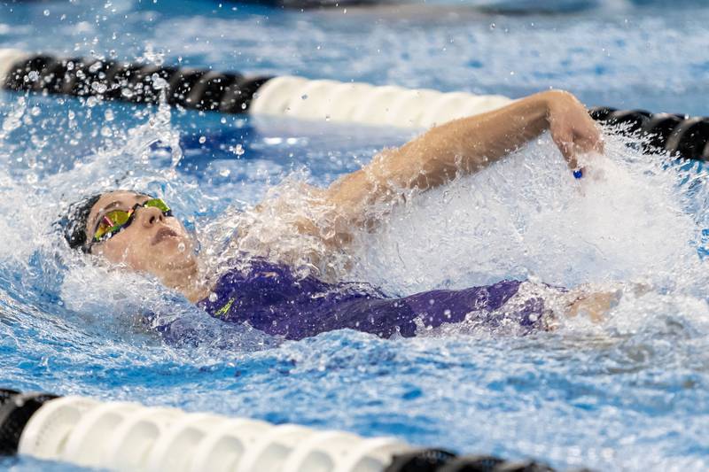 Lyons’s Sydney Kail competes in the 100 Yard Backstroke during the IHSA Girls State Swimming Preliminaries at FMC Natatorium in Westmont on Nov. 14, 2025.
