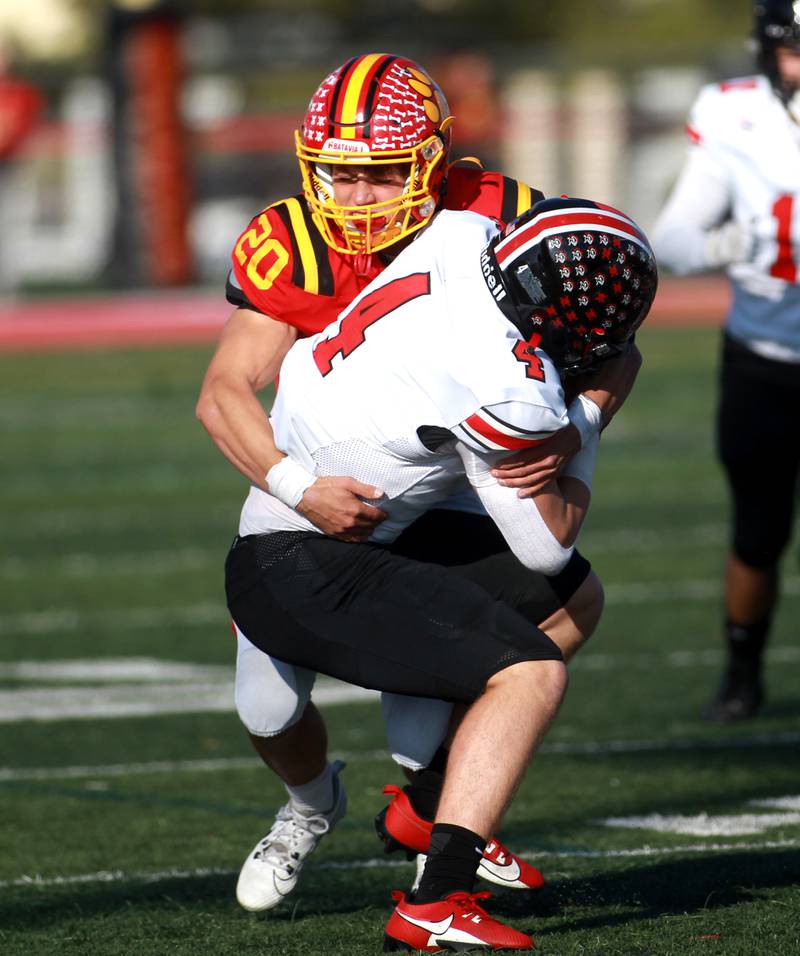 Batavia’s Chase Osborne takes down Lincoln-Way Central ball carrier Braden Meyer during the Class 7A second round playoff game in Batavia on Saturday, Nov. 4, 2023.