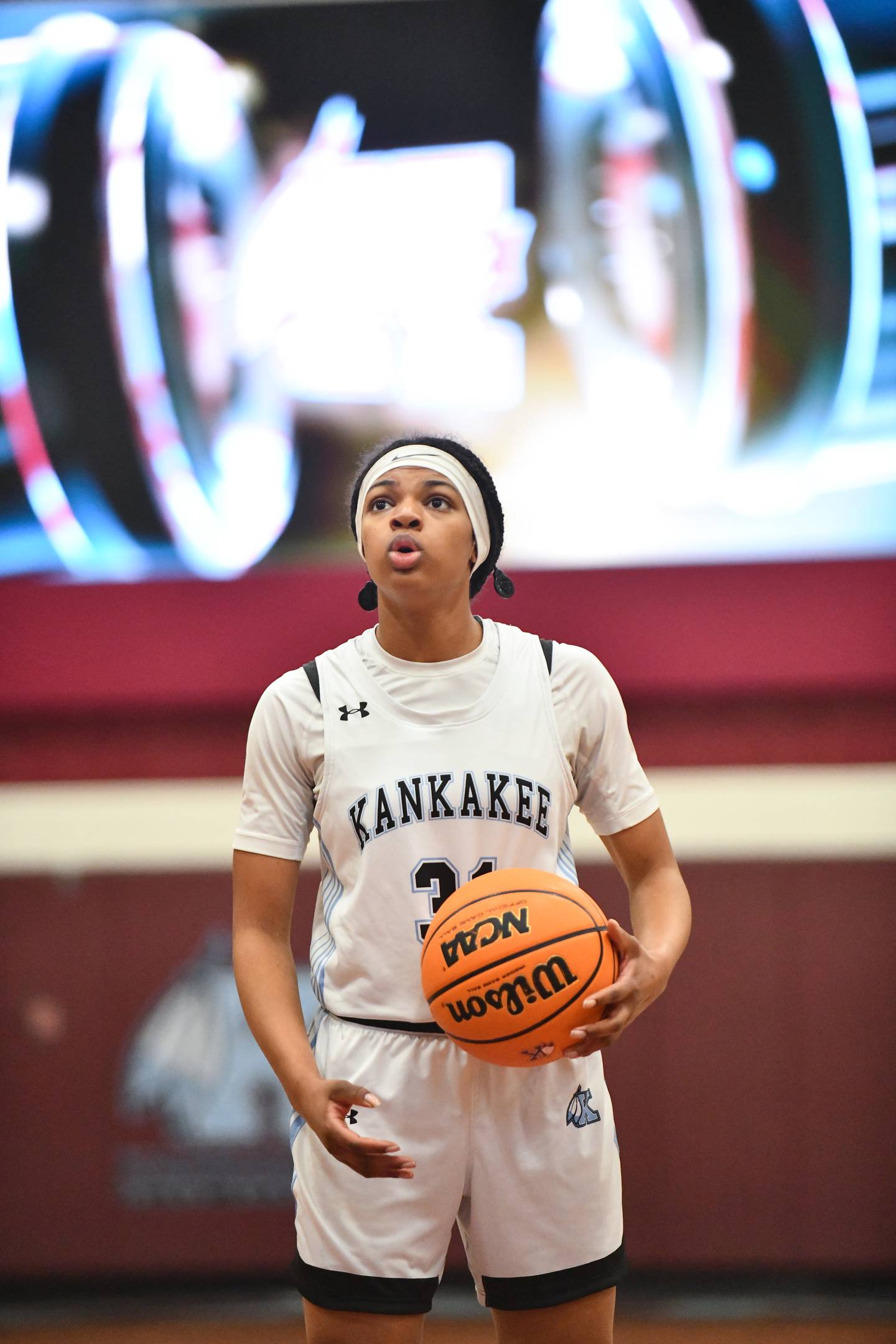 Kankakee senior TaLeah Turner focuses on a free throw, with her cochlear implants temporarily disconnected for silence, during her senior night game on Feb. 6, 2025, at Kankakee High School.