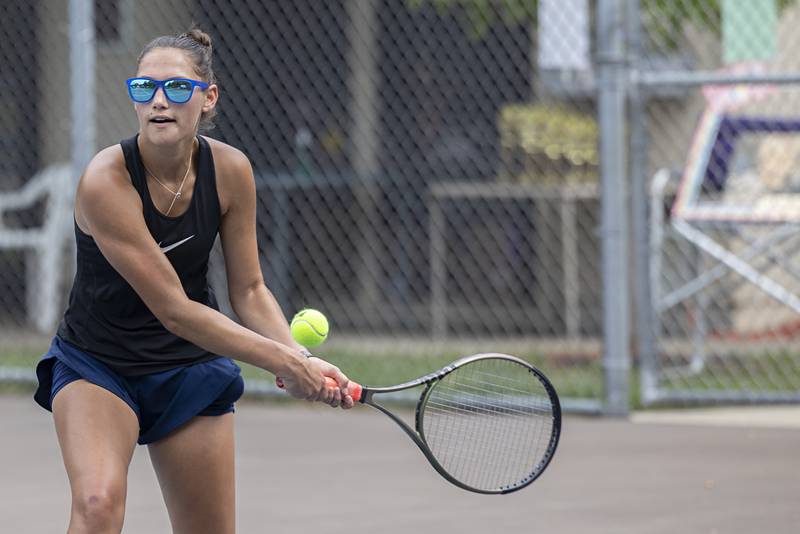 Brooklyn Arjes returns a shot during a doubles match Thursday, July 27, 2023 at the Emma Hubbs Tennis Classic in Dixon.