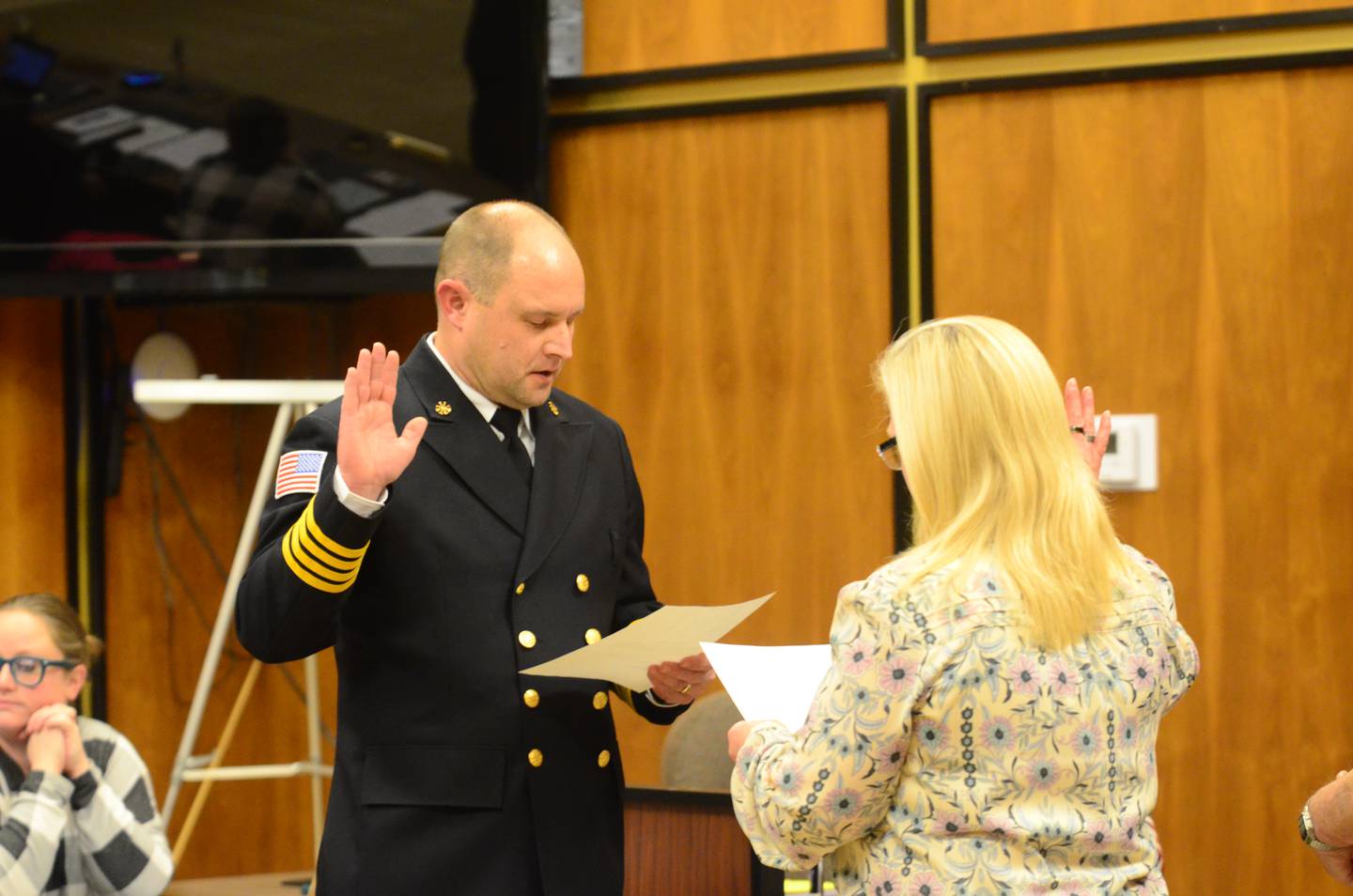 Rock Falls Fire Capt. Nathan Hartman (left) takes the oath of office for his new role as deputy chief Tuesday, Jan. 20, at the Rock Falls City Council meeting.