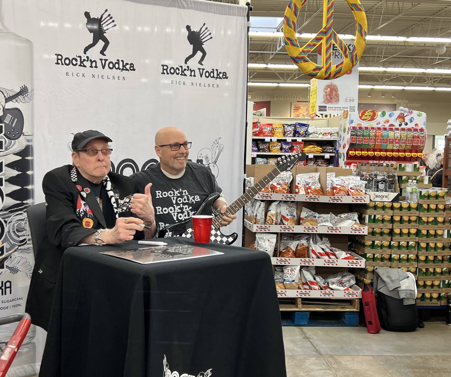 Tim Volz, an investor in Rock'n Vodka drove more than four hours to be among the first to have Rick Nielsen of Cheap Trick sign his custom made guitar at the Sycamore Hy-Vee on Feb. 9, 2024.