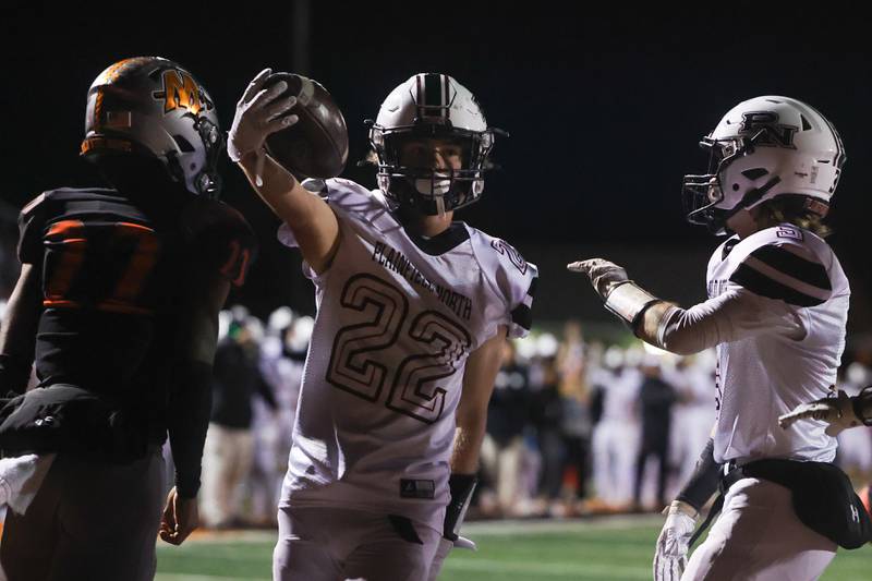 Plainfield North’s John St. Clair stretches the ball out after scoring against Minooka. Friday, Oct. 7, 2022, in Minooka.