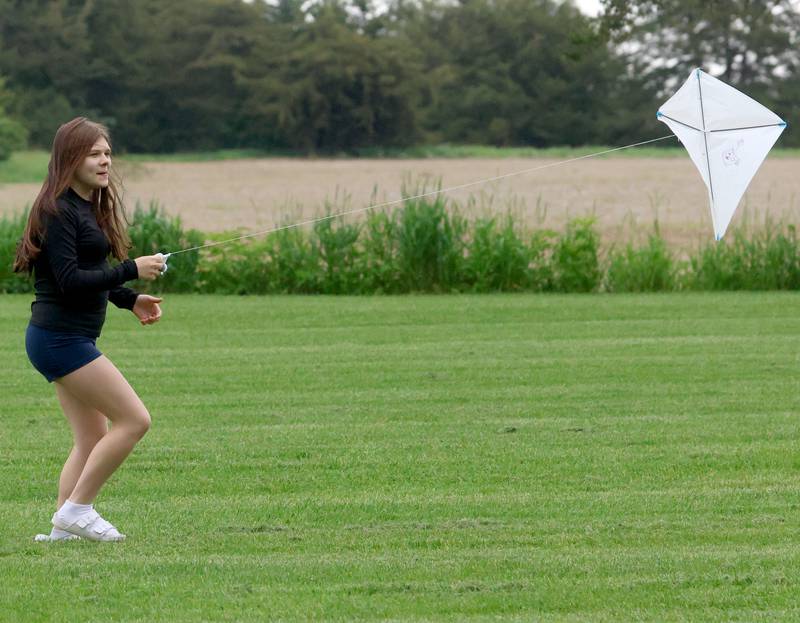 Tia Bushman of Princeton, flies her kite during the Second Story Teen Center kite flying contest on Wednesday, May 20, 2026 at City County Park in Princeton. 
The event featured over 2 dozen kites, hot dogs, games and more.