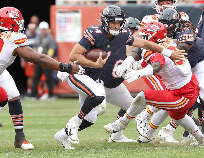 Chicago Bears quarterback Nathan Peterman scrambles away from the Kansas City Chiefs pressure during their preseason game Aug. 13, 2022, at Soldier Field in Chicago.