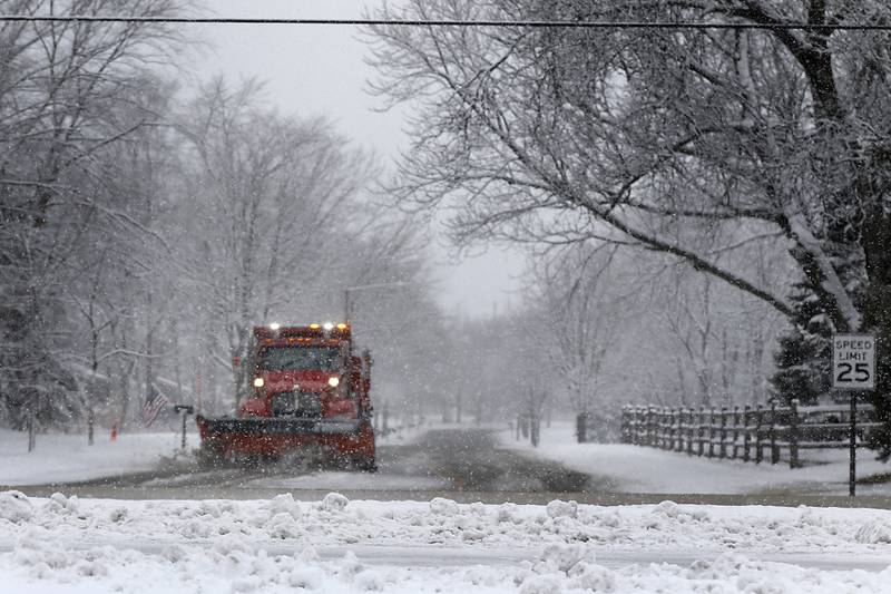 A Crystal Lake Department of Public Works snowplow clears snow Jan. 25, 2023, from Talismon Drive in Crystal Lake. Snow fell throughout the morning, leaving a fresh blanket of snow in McHenry County.