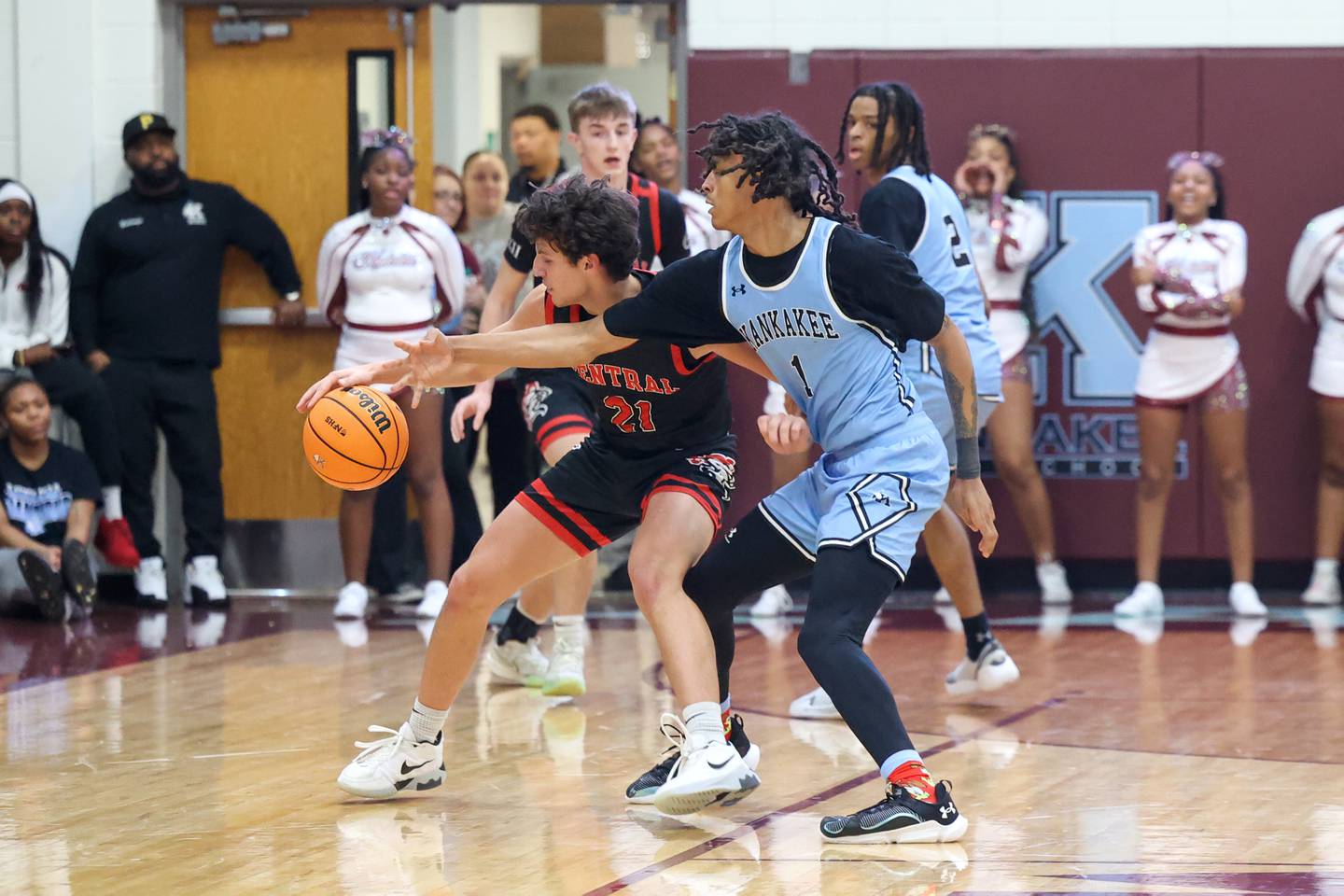 Lincoln-Way Central's Alex Panos fends off Kankakee's Lincoln Williams during the Kays' 54-50 victory over Lincoln-Way Central in the 75th Kankakee Holiday Tournament maroon bracket championship on Sunday, Dec. 28, 2025.