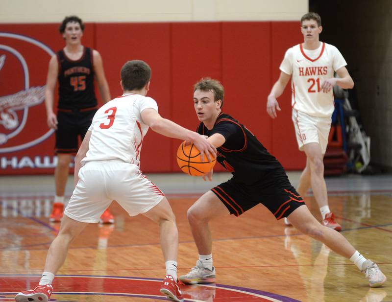 Erie-Prophetstown's Connor Keegan (right) reaches for the ball as Oregon's Cooper Johnson brings it up the court on Monday, Feb. 24, 2025 in 2A regional action at the Blackhawk Center in Oregon.