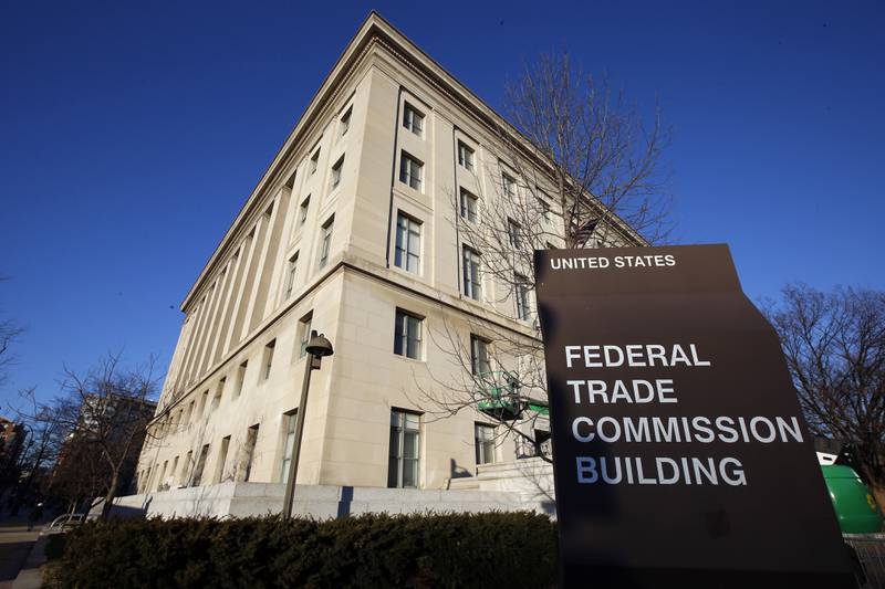 FILE - The Federal Trade Commission building, Jan. 28, 2015, in Washington. Parents whose kids bought virtual gear without their knowledge on the popular Fortnite video game could soon be able to get a refund. The U.S. regulators are starting to notify more than 37 million people by email that they may be eligible for compensation as part of a legal settlement with Fortnite’s maker, Epic Games Inc. (AP Photo/Alex Brandon, File)