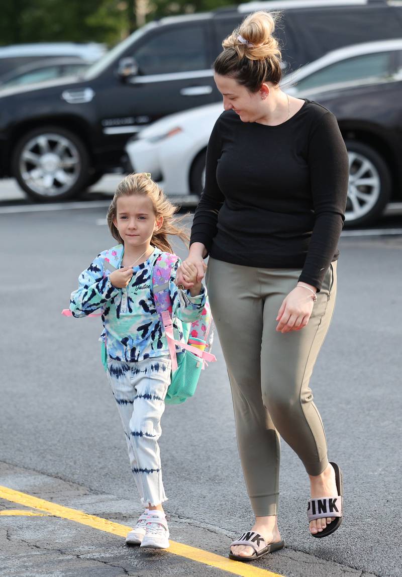Gwendolyn Brooks Elementary School first grader Aida Bekjiri and her mom Mjaftime Rusiti arrive at the school Thursday, Aug. 17, 2023, on the first day of school for most students in DeKalb.