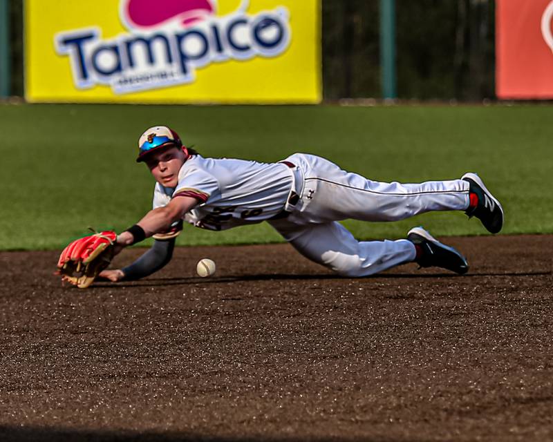 St. Ignatius Aidan Thaxton (6) dives for a grounder during the Class 3A Crestwood Supersectional game between St. Ignatius at Nazareth.  June 6, 2022.