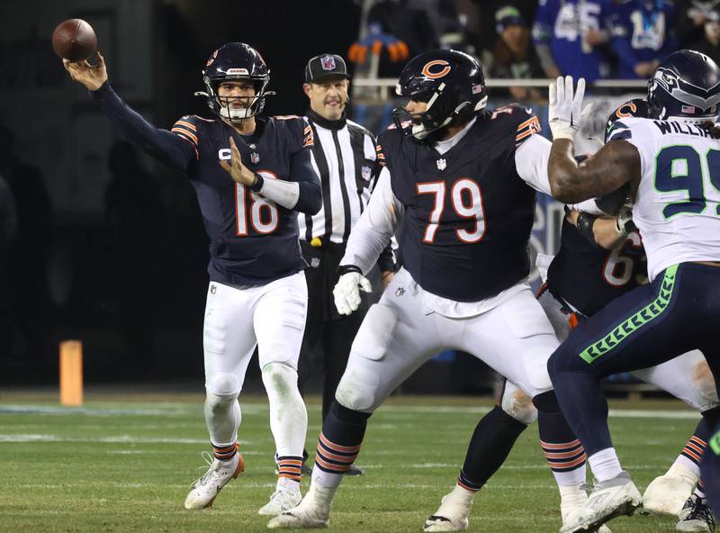 Chicago Bears quarterback Caleb Williams throws a pass behind the protection of guard Matt Pryor during their game against the Seattle Seahawks Sunday, Dec. 26, 2024, at Soldier Field in Chicago.