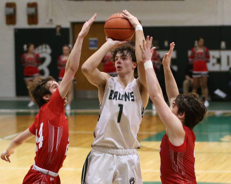 St. Bede's Connor Brown (center) bearly gets his shot off as Hall's Kylan Smith (left) and Ashton Pecher (right) defend on Monday, Dec. 14, 2022 at St. Bede Academy.