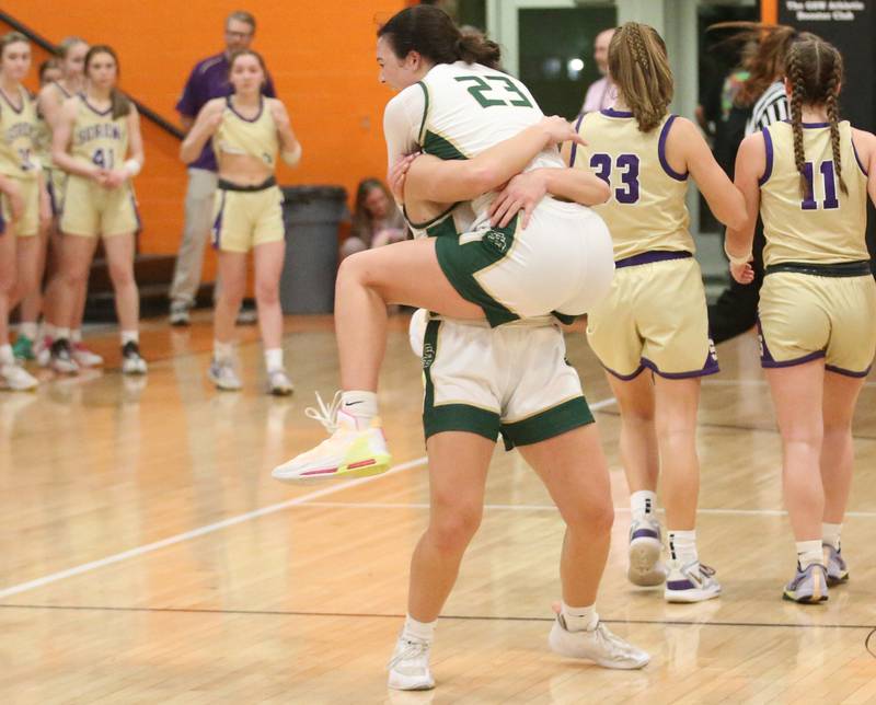 St. Bede's Ali Bosnich hugs teammate Ella Hermes after defeating Serena in the Class 1A Sectional final game on Thursday, Feb. 22, 2024 at Gardner-South Wilmington High School.