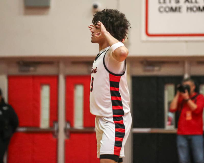 Benet's Jayden Wright (3) gestures to the bench after hitting a three pointer during their Class 4A Bolingbrook Sectional semifinal basketball game between Yorkville at Benet, March 3, 2026 in Bolingbrook.