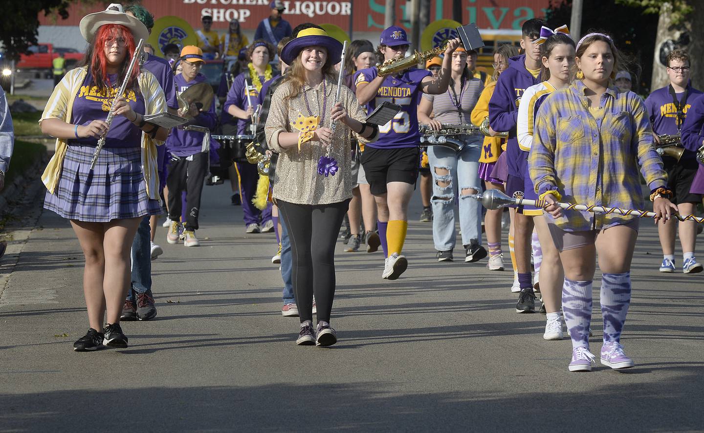 The Mendota High School Marching Band, dressed in colorful attire, marches down Wisconsin Street on Thursday, Oct. 6, 2022, during the school’s homecoming parade.