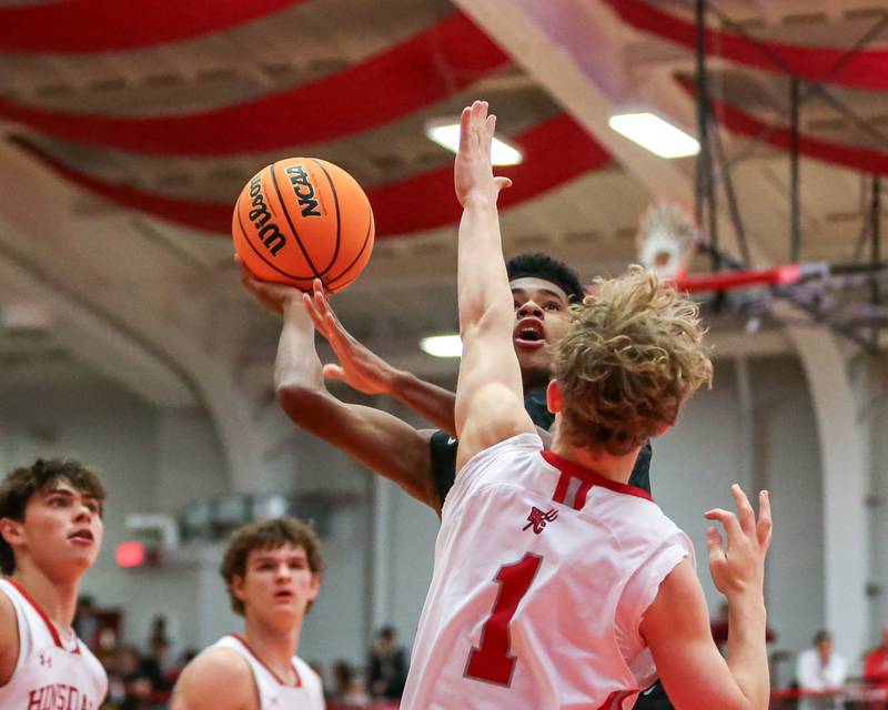Glenbard West's TJ Williams (3) puts up a contested shot during their basketball game between Glenbard West at Hinsdale Central, Friday  Dec 6, 2024  in Hinsdale.