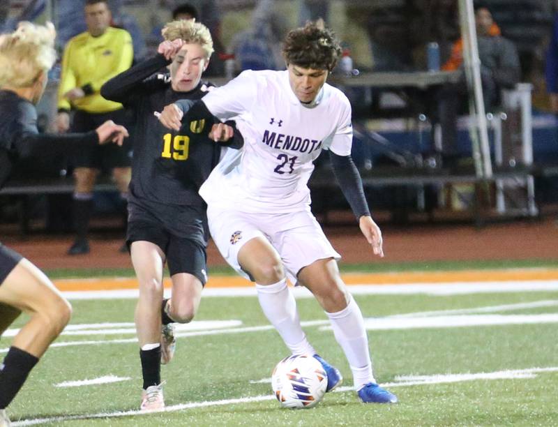 Normal U-High's Myles Parola has the ball stolen from Mendota's Isaac Diaz during the Class 1A State semifinal game on Thursday, Nov. 7, 2024 at Hoffman Estates High School.