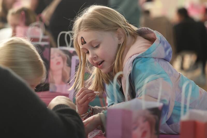 Grace Holzhauser, 9-years old, works on a craft at the Taylor Swift fan party hosted by the Lockport Township Park District on Saturday, Feb. 10, 2024 in Lockport.