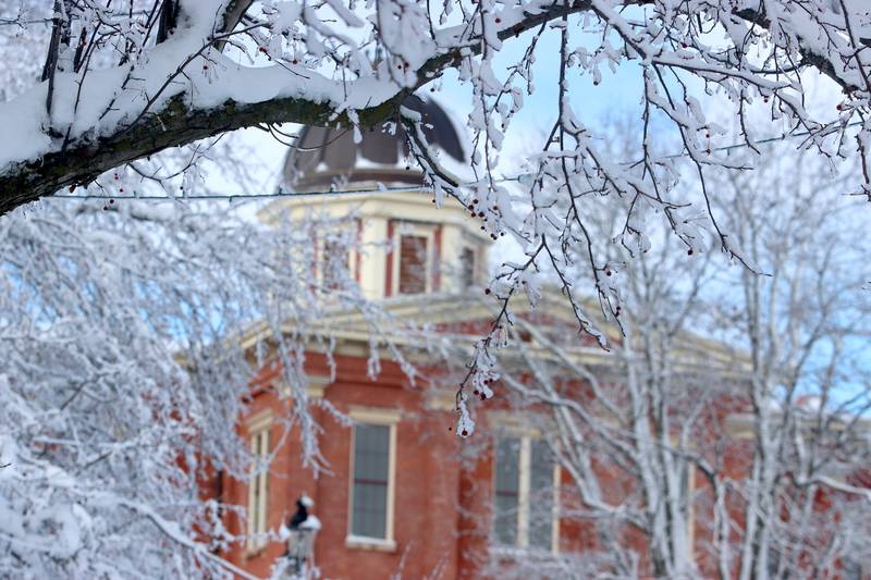 The Woodstock Square is covered Saturday in the wake of overnight snow. Bitter cold is expected to worsen into Sunday, the National Weather Service warned.