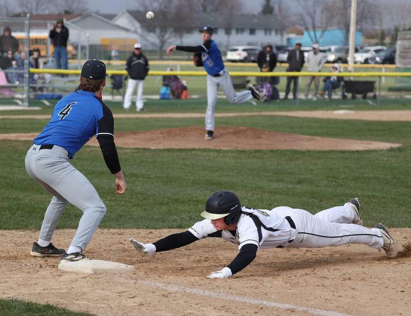Sycamore's Henry Hamingson gets back to first safely as St. Charles North pitcher Emerson Miller throws to first baseman Ty Heimbuch during their game Thursday, April 10, 2025, at the Sycamore Park District Sports Complex.