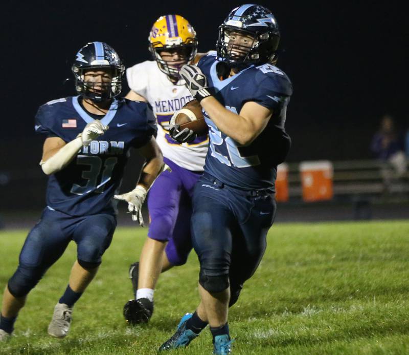 Bureau Valley's Elijah Endress runs the ball down the field as teammate Cameron Lemons runs beside while being chased down by Mendota's Joe Stewart on Friday, Sept. 22, 2023 at Bureau Valley High School.