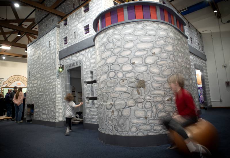 Children play in and around the castle in Exploration Station at Perry Farm Park during an open house and farewell party for the long-lived castle Feb. 21, 2025.