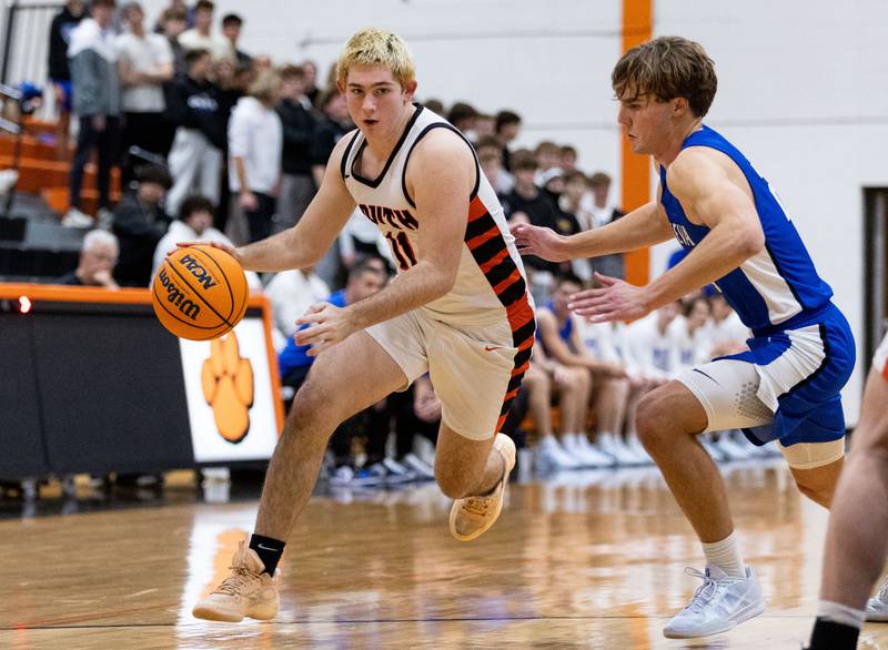 Wheaton Warrenville South’s Zach Rogers drives the lane during a home game against Geneva High School on Tuesday, Dec. 3, 2024.