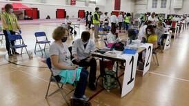 How are school districts in McHenry County doing when it comes to the vaccine mandate?