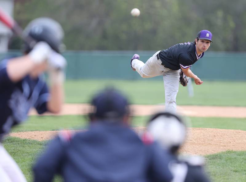 Downers Grove North's Joseph Chiarelli (4) watches his pitch during the varsity baseball game between Downers Grove South and Downers Grove North in Downers Grove on Saturday, April 29, 2023.