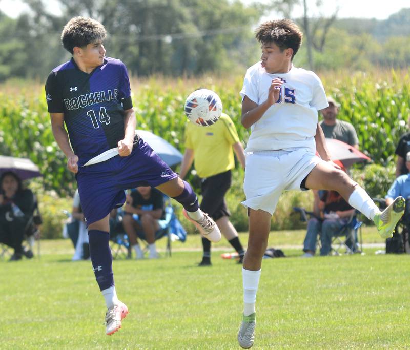 Rochelle's Antonio Hueramo (14) and Genoa-Kingston's Chris Fuentes (35) battle for the ball during Saturday, Aug. 30, 2025 action at a the Oregon-Stillman Varsity Soccer Tourney at Oregon Park West.