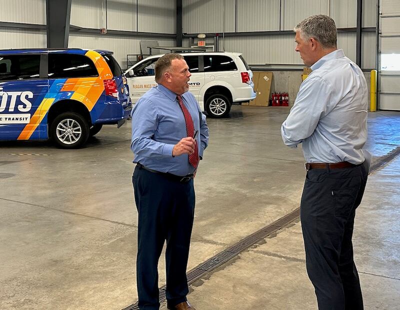 LOTS Executive Director Greg Gates (left) discusses public transportation updates with U.S. Rep. Darin LaHood, R-Peoria, during LaHood's visit to the Lee Ogle Transportation System facility in Dixon on Aug. 31, 2023.