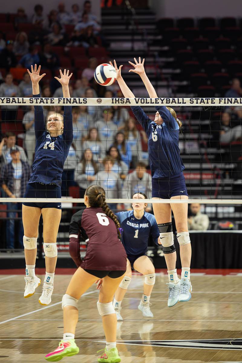 Cissna Park's Annika Stadeli, left, and Marina Day jump to block a hit during the Timberwolves' victory in two sets, 25-19, 25-20, over Tremont in the IHSA Class 1A State semifinals on Friday, Nov. 14, 2025.