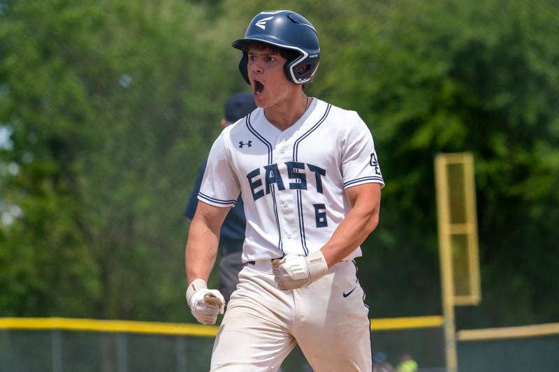 Oswego East's Liam Mitchell (6) celebrates after driving in a run against Waubonsie Valley during the Class 4A Waubonsie Valley Regional final between Waubonsie Valley and Oswego Easy at Waubonsie Valley High School in Aurora on Saturday, May 27, 2023.