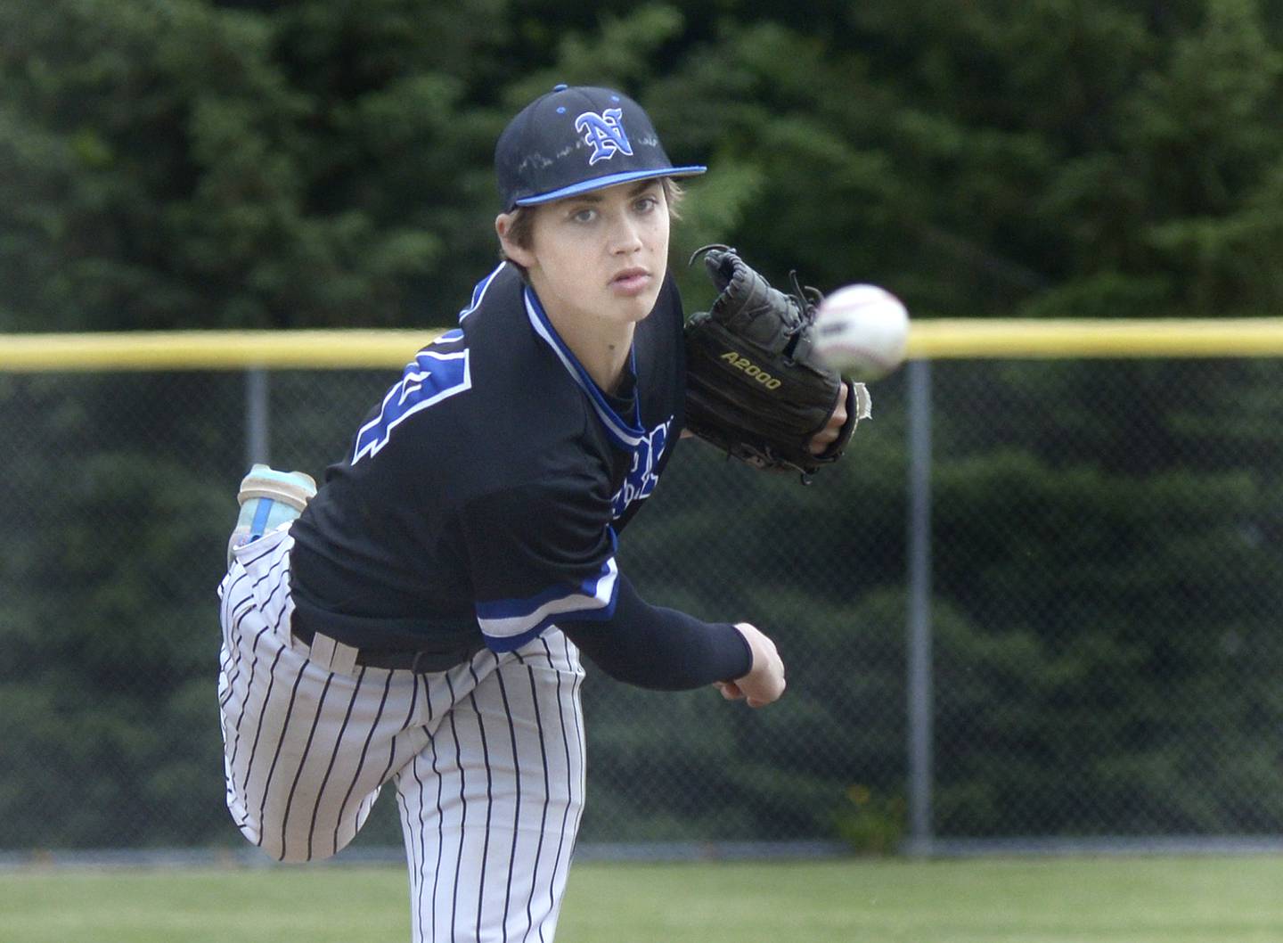 Newark’s starting pitcher Eastin McBroom fires a pitch against Marquette Saturday at Masinelli Field.