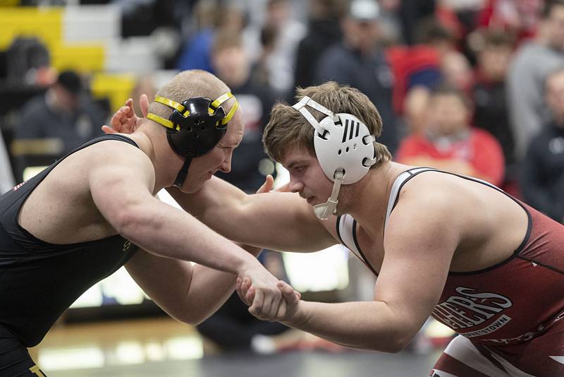 Riverdale’s Jack Schradeya (left) and Erie’s John Holland work in the 215 pound finals Saturday, Jan. 31, 2026, during the Class 1A Wrestling Regionals at Riverdale High School. Schradeya won 5-1.
