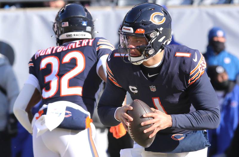 Chicago Bears quarterback Justin Fields rolls out during their game against the Buffalo Bills Sunday, Dec. 24, 2022, at Soldier Field in Chicago.