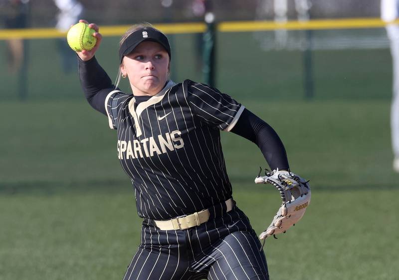 Sycamore's Addison Armstrong throws the ball to first Friday, April 11, 2025, during their game against Marengo at Sycamore High School.